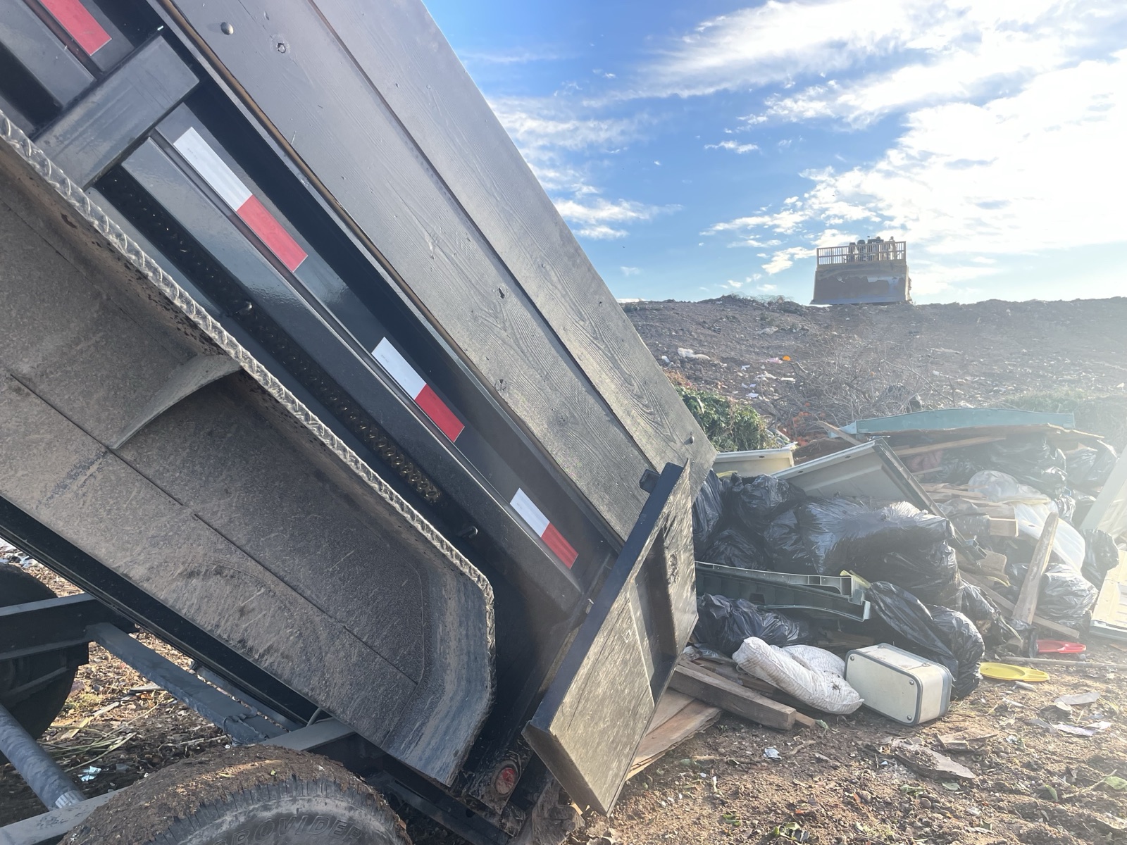 Dump trailer loaded with broken-out concrete from a removal job