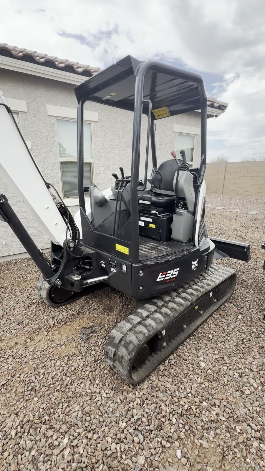 Bobcat E35 excavator with hydraulic thumb staged at a Peoria, AZ jobsite